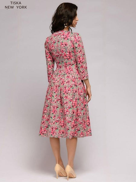 Model wearing A-Line, crewneck, knee length vintage cocktail dress. Pink Floral Printed dress back side