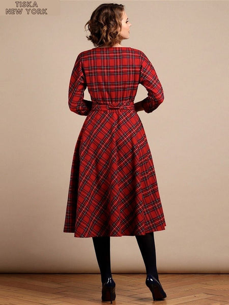 Woman wearing mid calf red plaid dress back