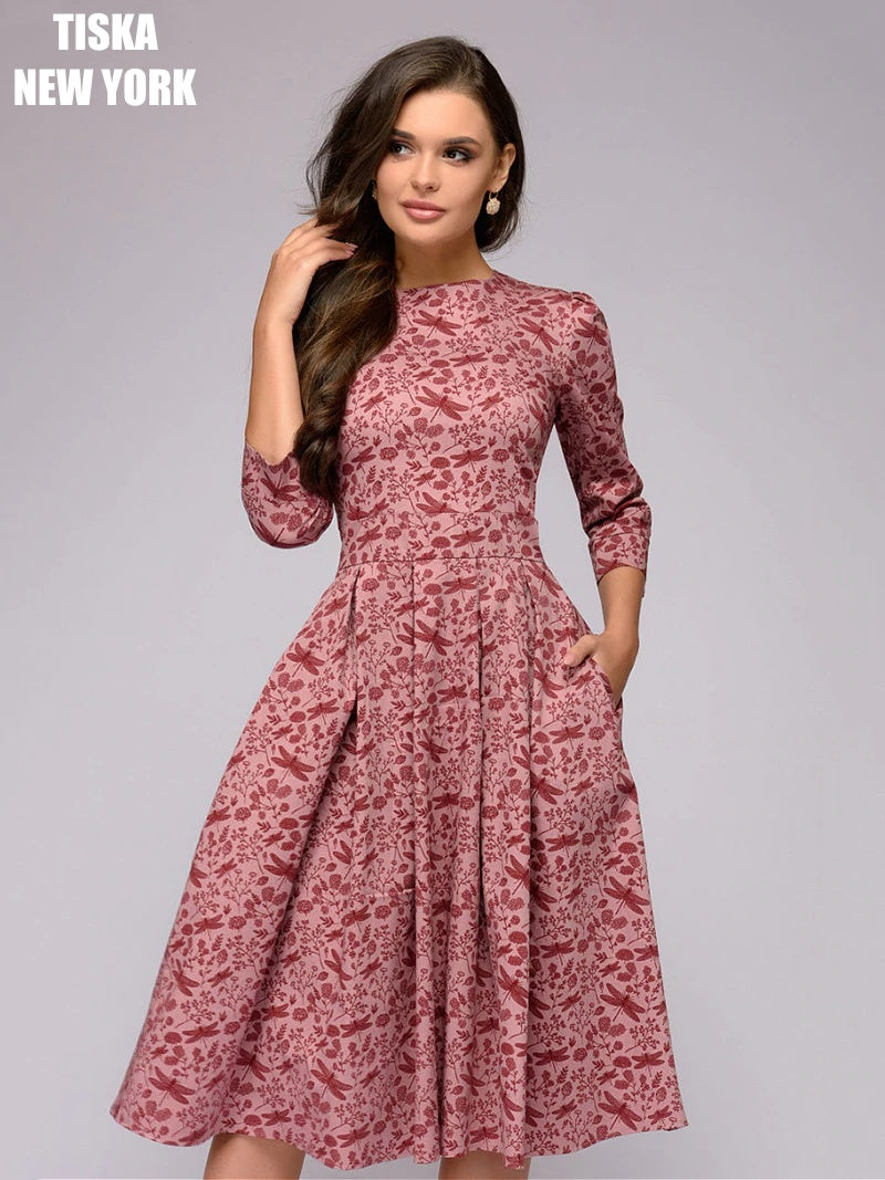 Woman wearing vintage peach colored printed dress closeup