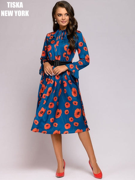 Woman wearing african printed vintage dress with red stilletos