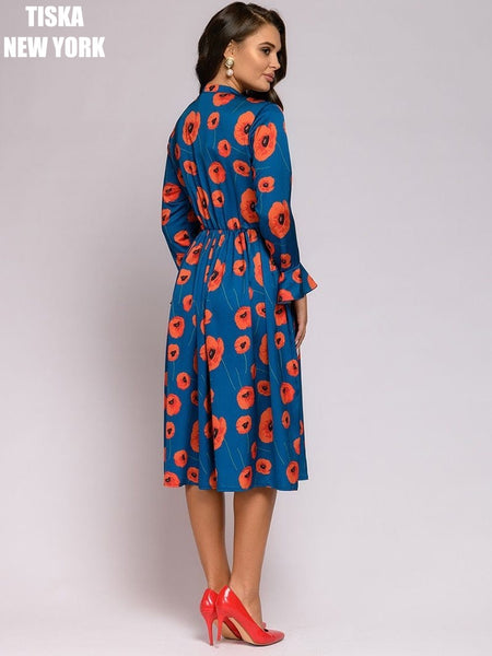 Woman wearing african printed vintage dress back side